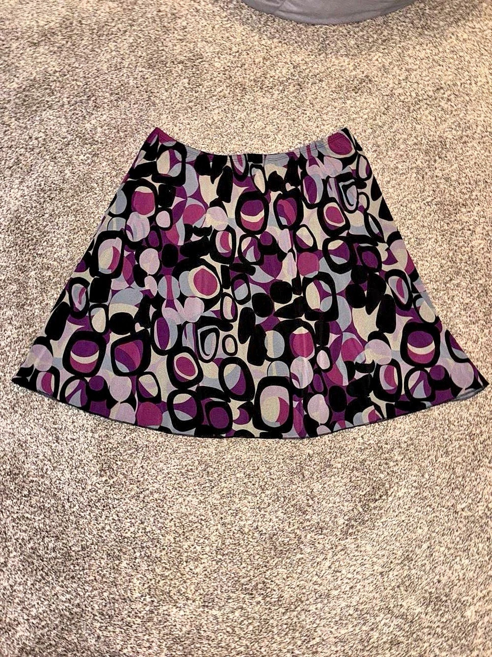 Y2K purple and black whimsy goth skirt with a polka dot design